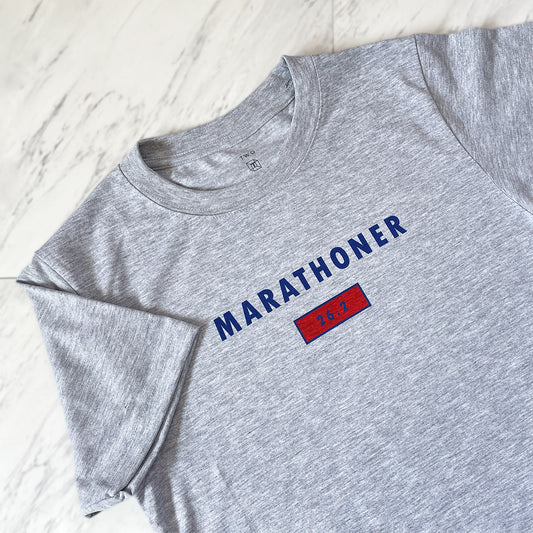 Marathoner 26.2 performance short sleeve shirt from TWO CORRALS Lifestyle Running Brand, minimalistic patriotic marathon tee in blue and red