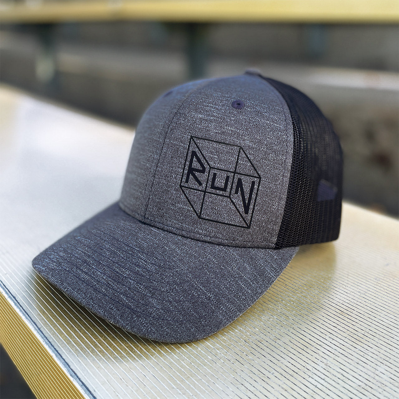 Trucker running hat from TWO CORRALS Lifestyle Running Brand, minimalistic run hat in dark gray and black