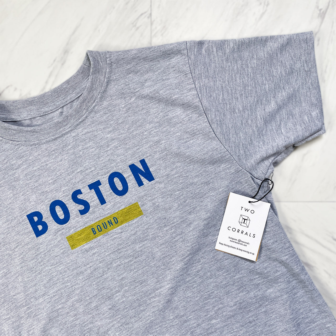 Boston bound (variation 1) performance short sleeve shirt from TWO CORRALS Lifestyle Running Brand, minimalistic Boston Bound shirt with Boston in blue and bound in yellow