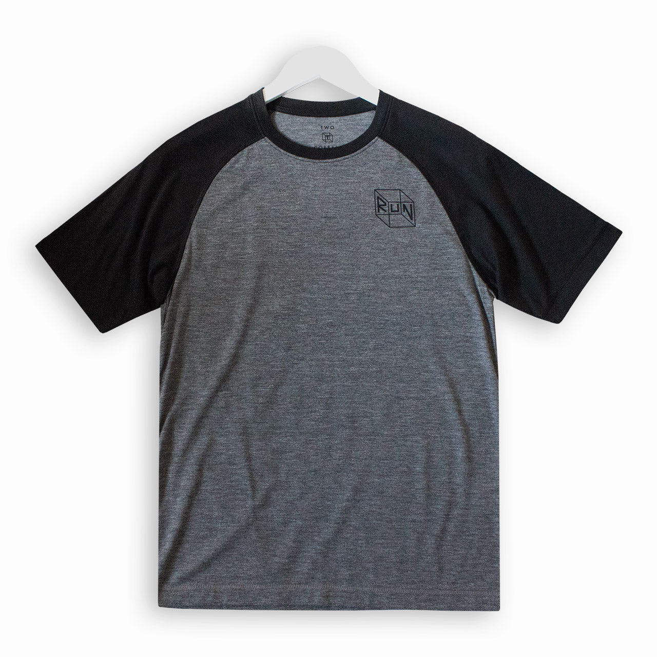 Our signature RUN cube design on a heathered gray and black performance raglan tshirt that is part of our RUN gift box set from TWO CORRALS Lifestyle Running Brand